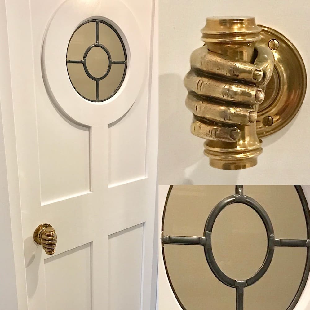 Custom pantry door with brass hand door knob